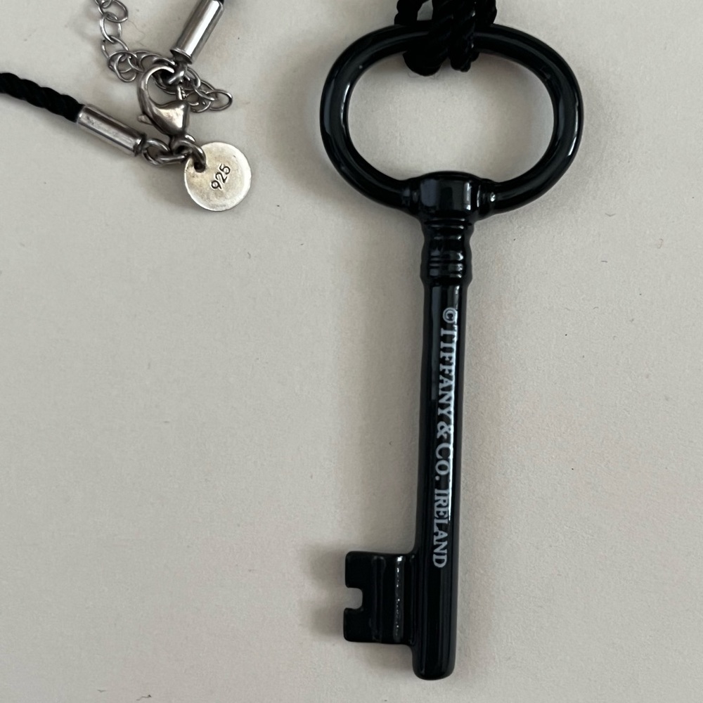 Authentic Tiffany and Co Black key necklace with original black cord necklace